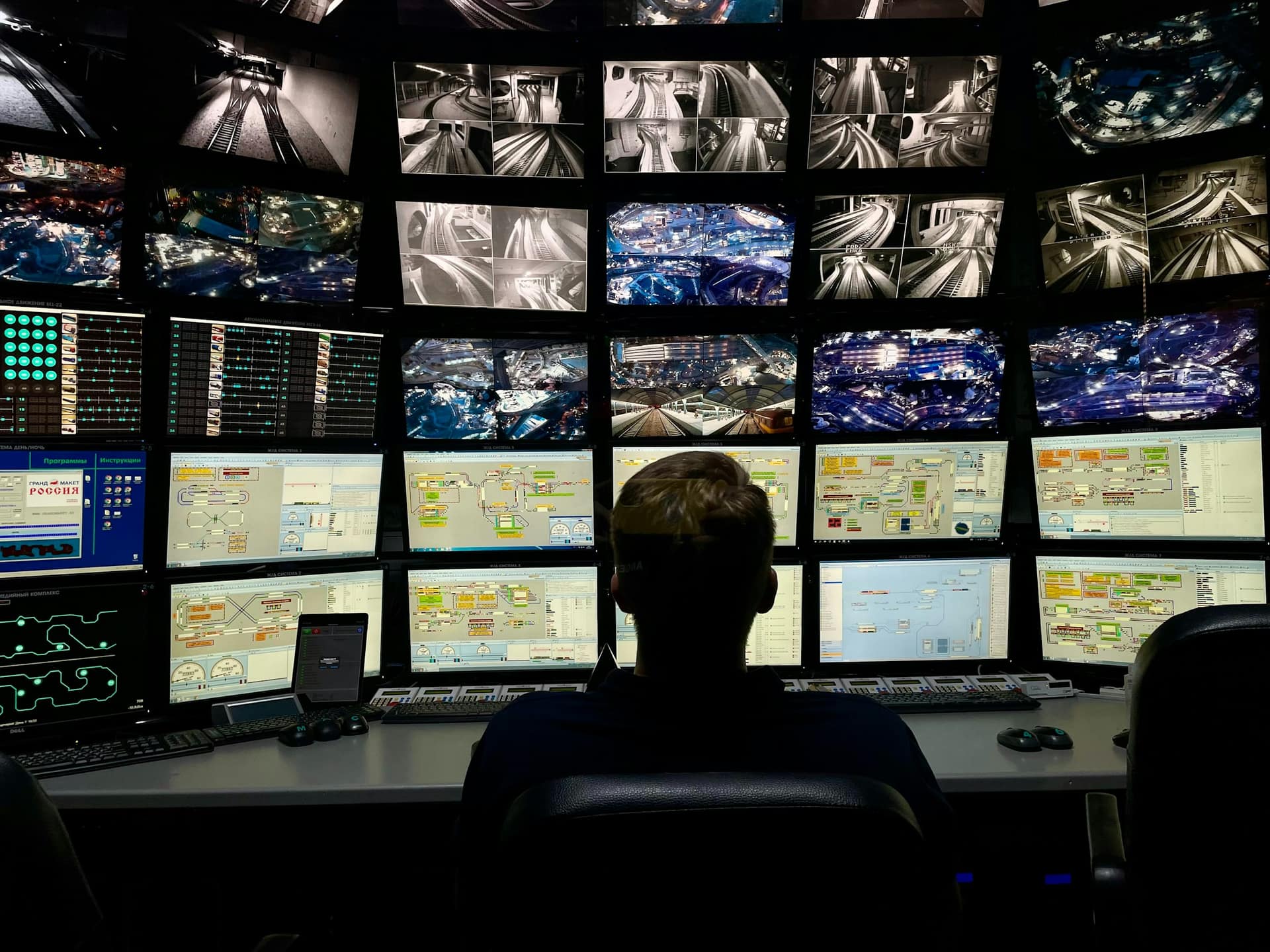 Operator monitoring live vehicle and route data across multiple tracking screens